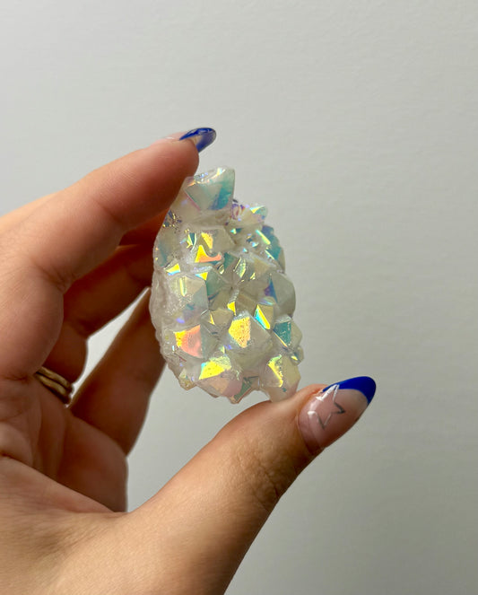 Altered aura quartz cluster