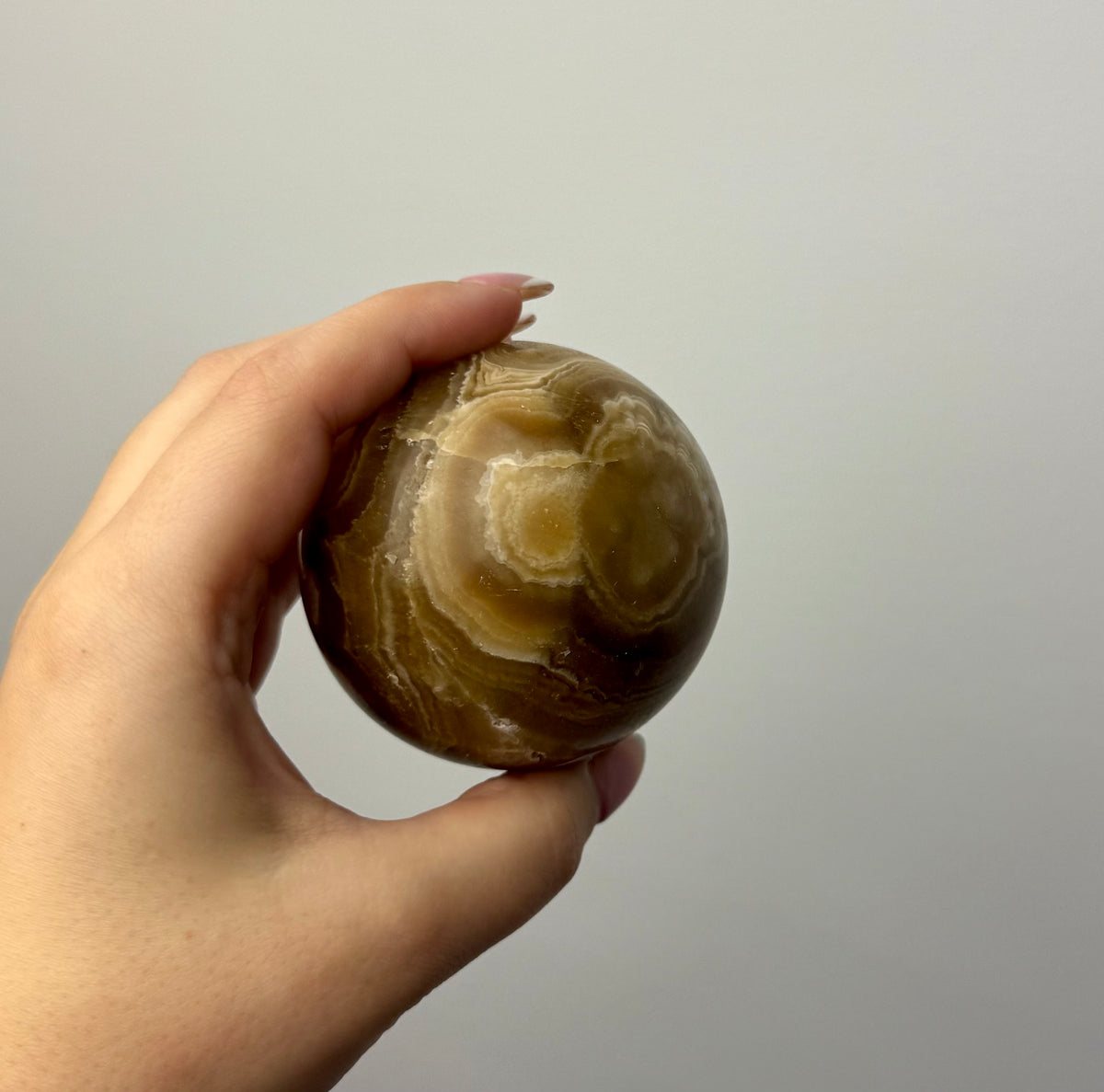 Amber calcite sphere