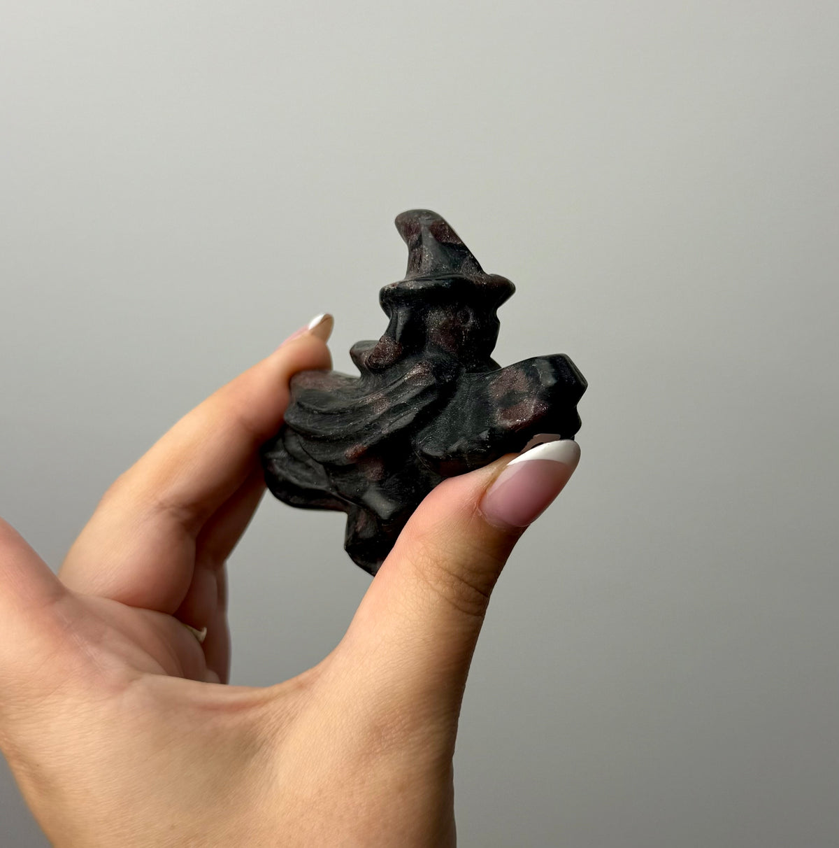 Flying witch carving