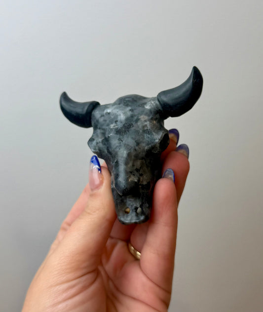 Larvikite cow skull carving