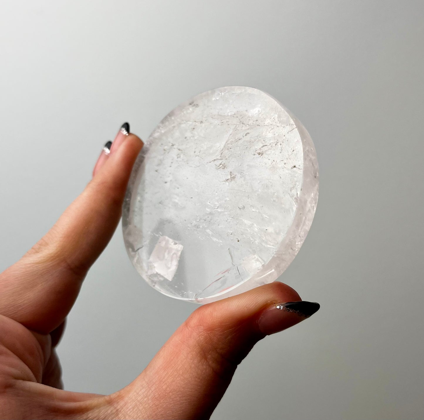 Clear quartz disk slab on stand