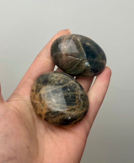 Black moonstone palm stones