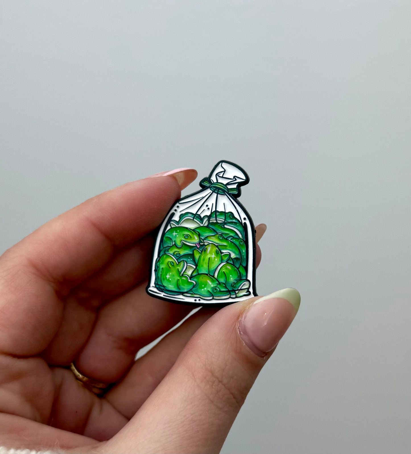 Bag of frogs enamel pin