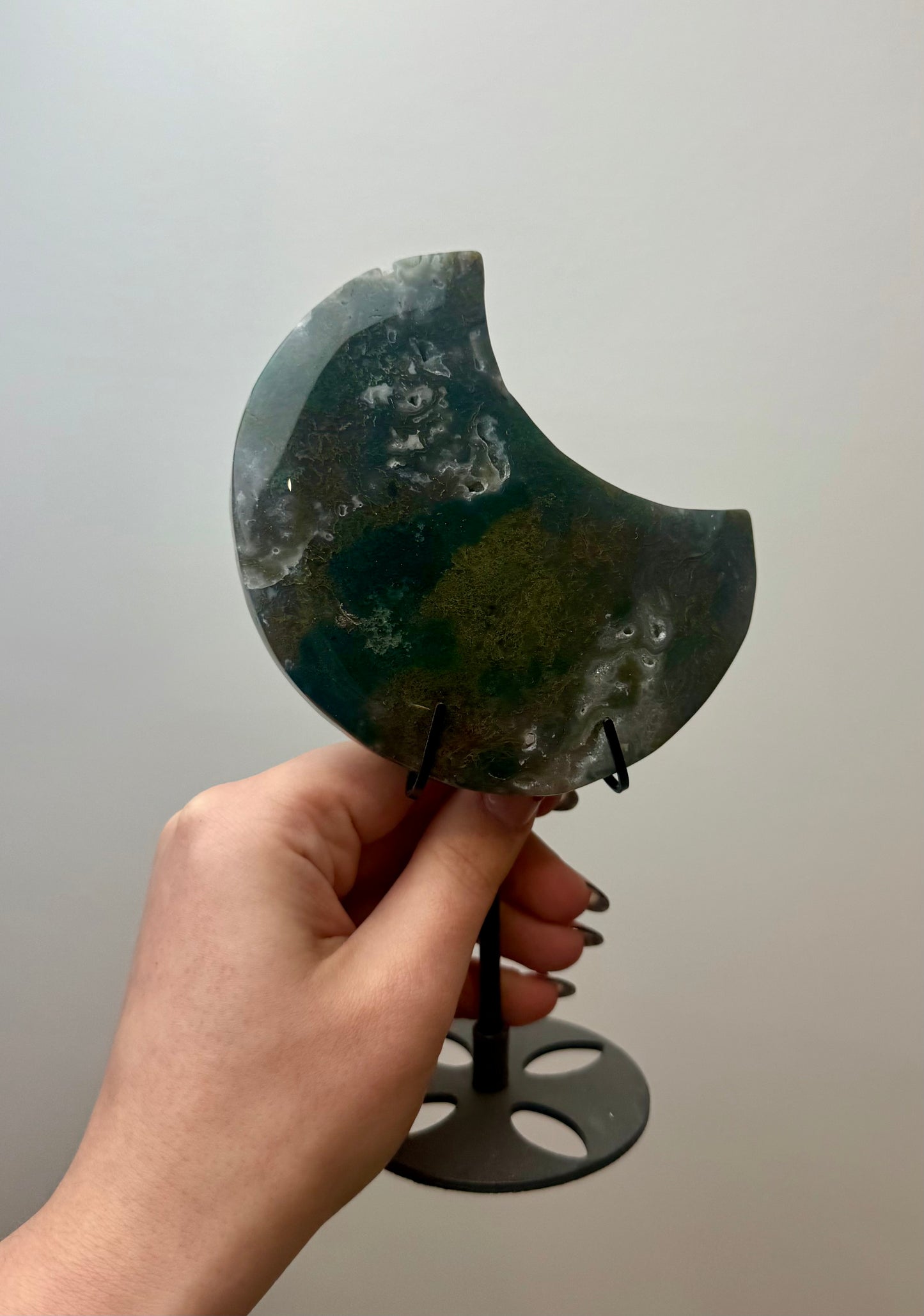 Moss agate moon carving on stand