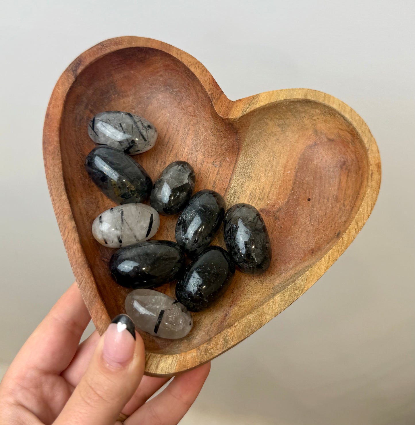 Black tourmaline in quartz tumbles