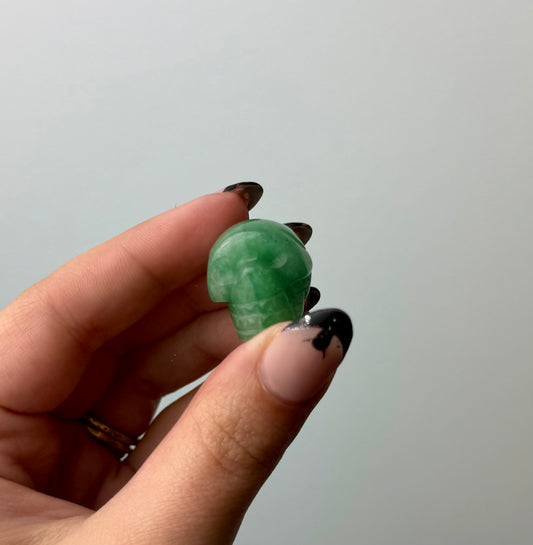 Green aventurine skull carving