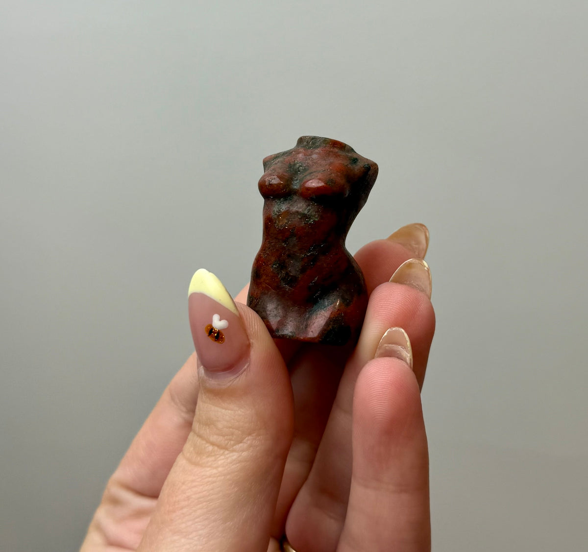 Brecciated jasper woman body carving