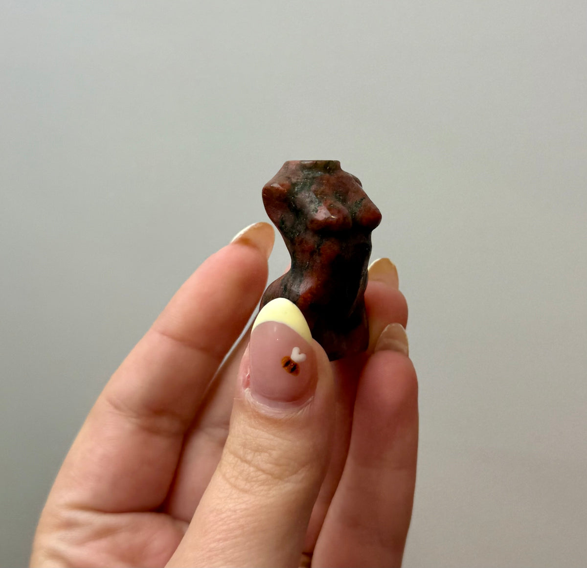Brecciated jasper woman body carving
