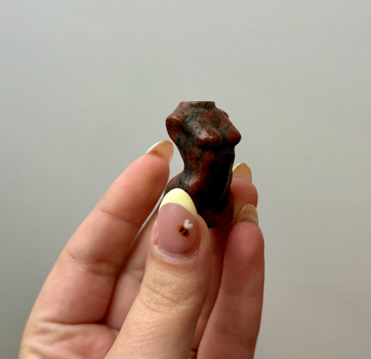Brecciated jasper woman body carving