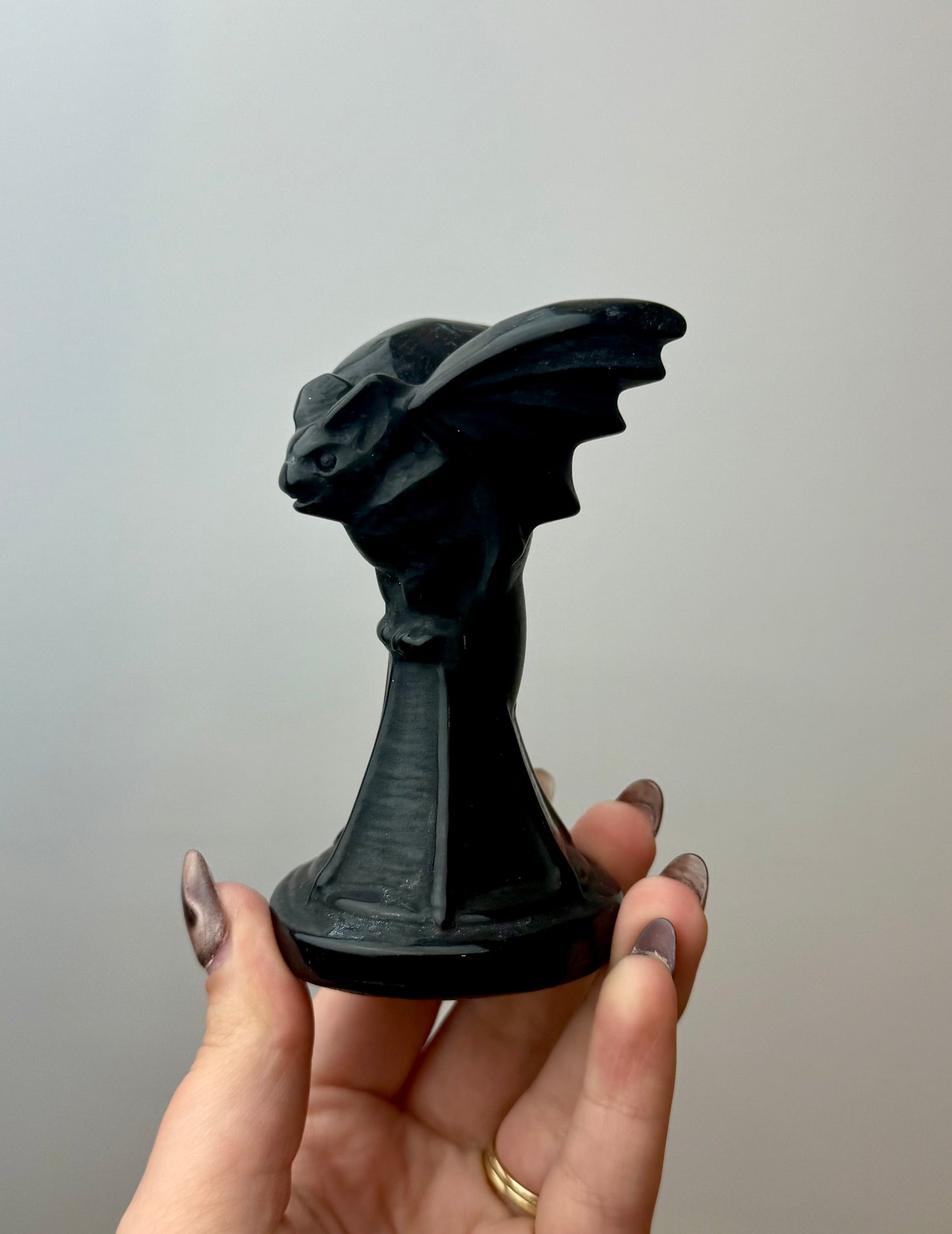 Obsidian bat carving