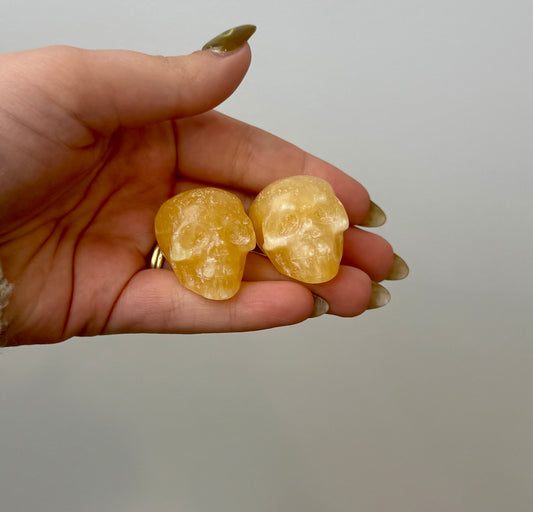 Orange calcite skull carvings