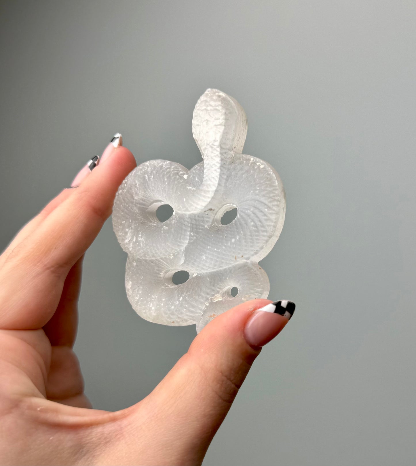 Satin spar snake carvings