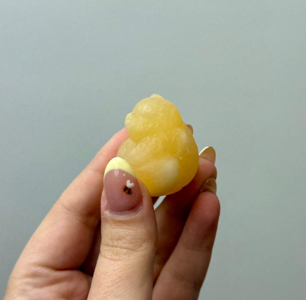 Orange calcite chubby pig carving