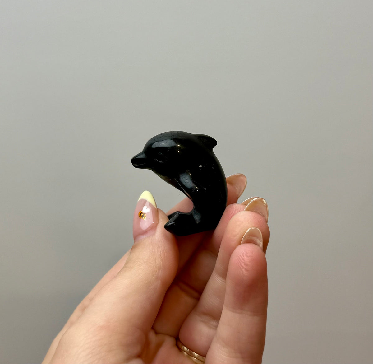 Obsidian dolphin carving
