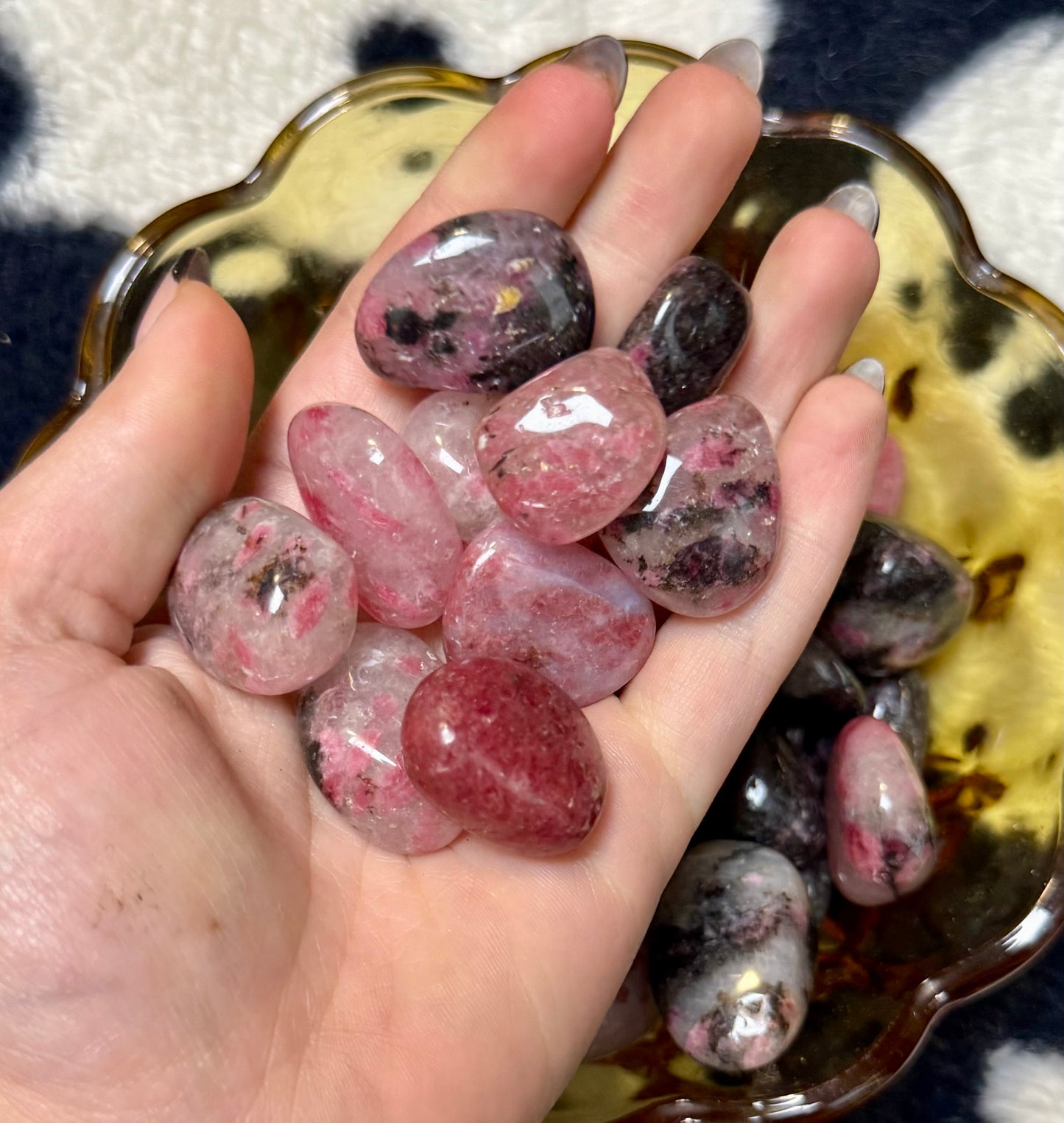 Icy rhodonite tumbles