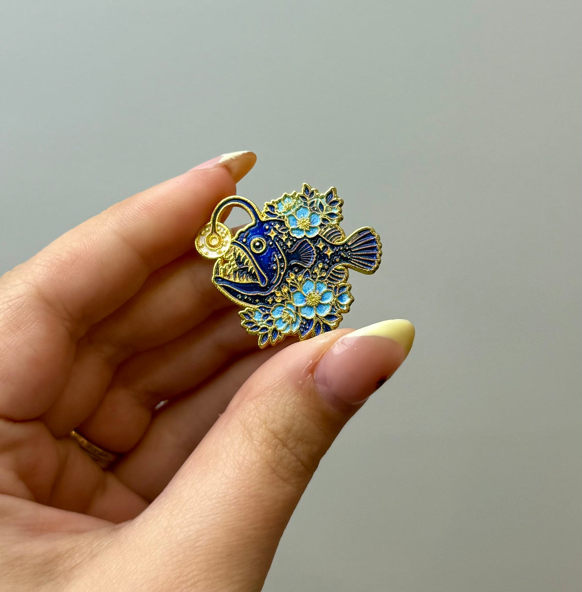 Anger fish enamel pin