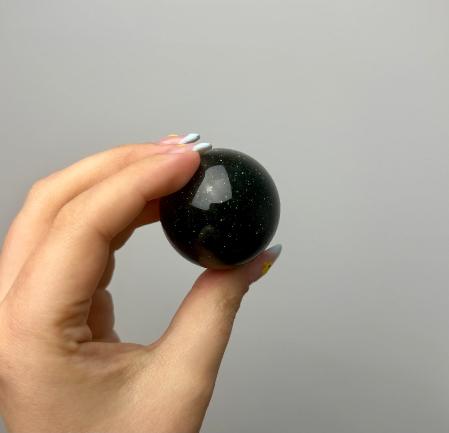 Green goldstone man made material sphere