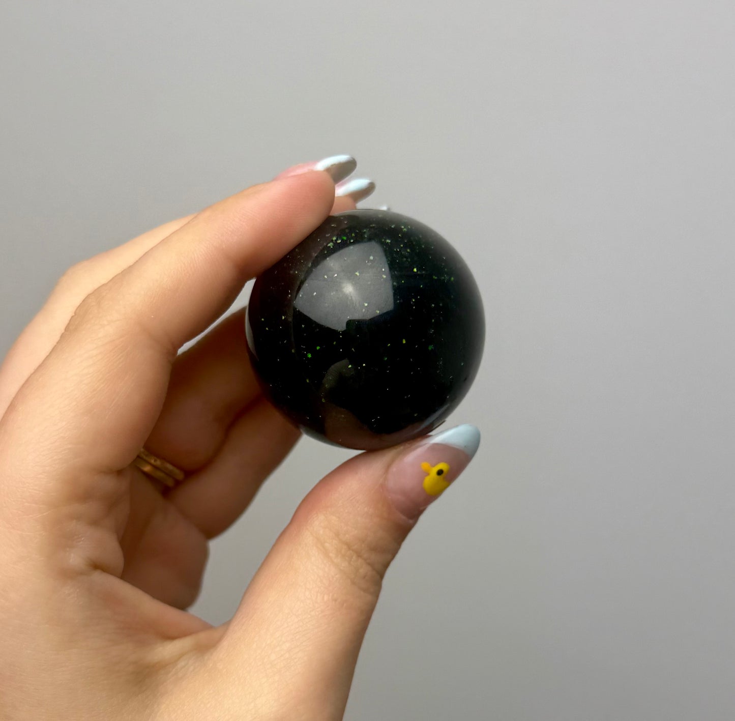 Green goldstone man made material sphere