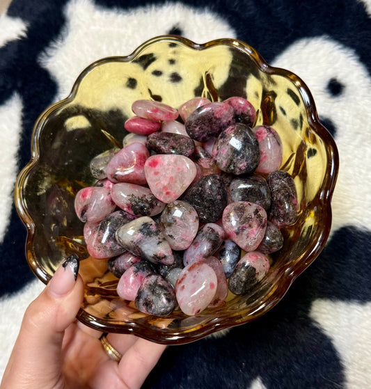 Icy rhodonite tumbles