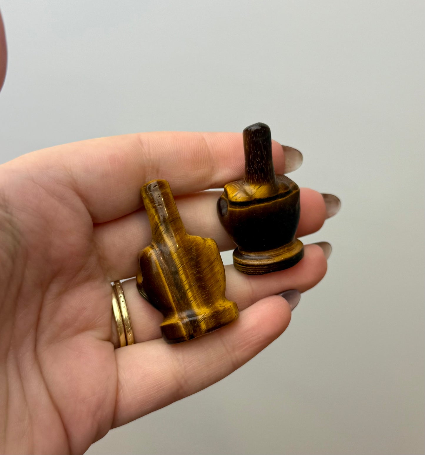 Tigers eye middle finger carvings