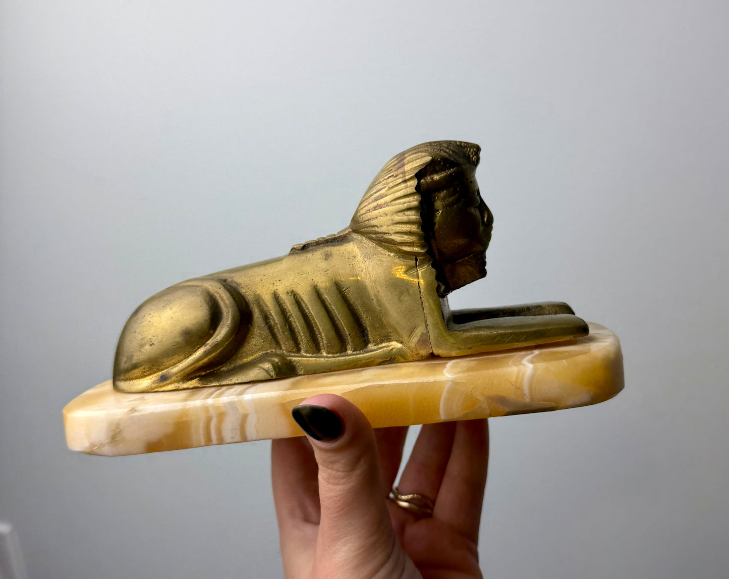 Orange calcite Spinx carving thrifted find ￼￼