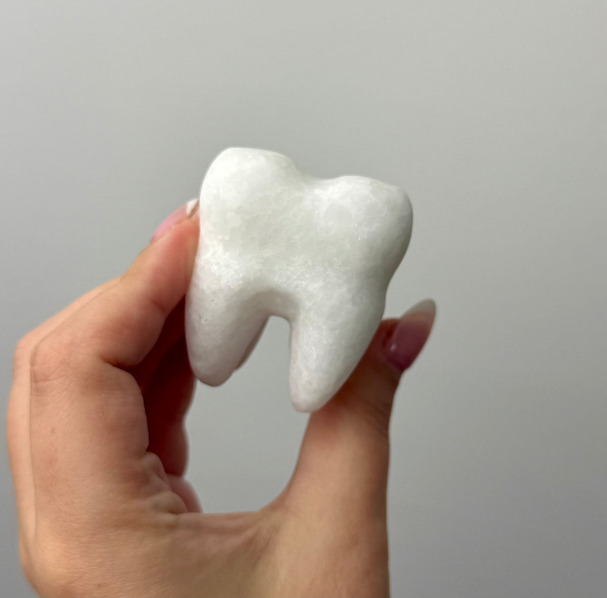 White jade tooth carvings