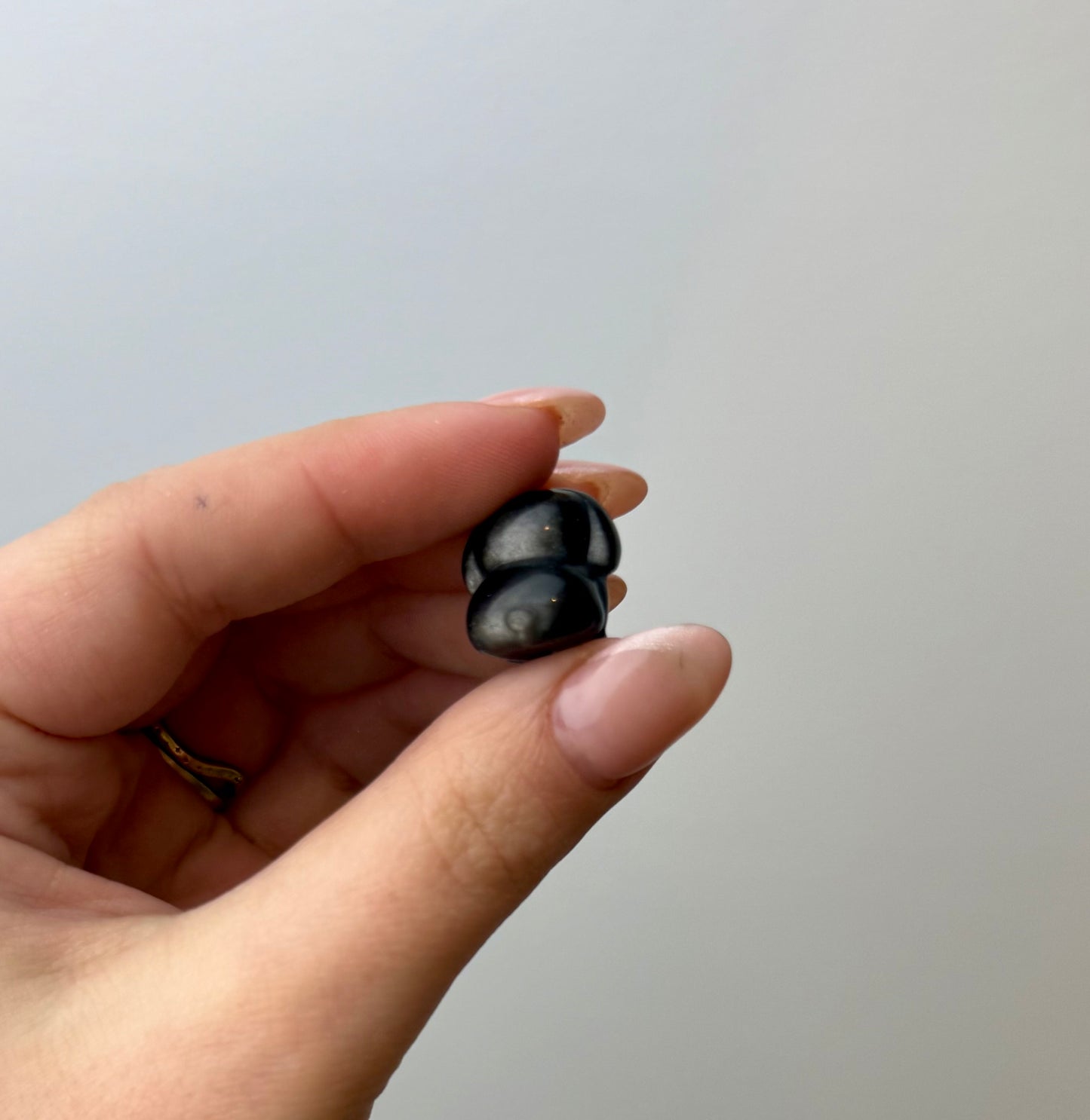 Silver obsidian dog carvings