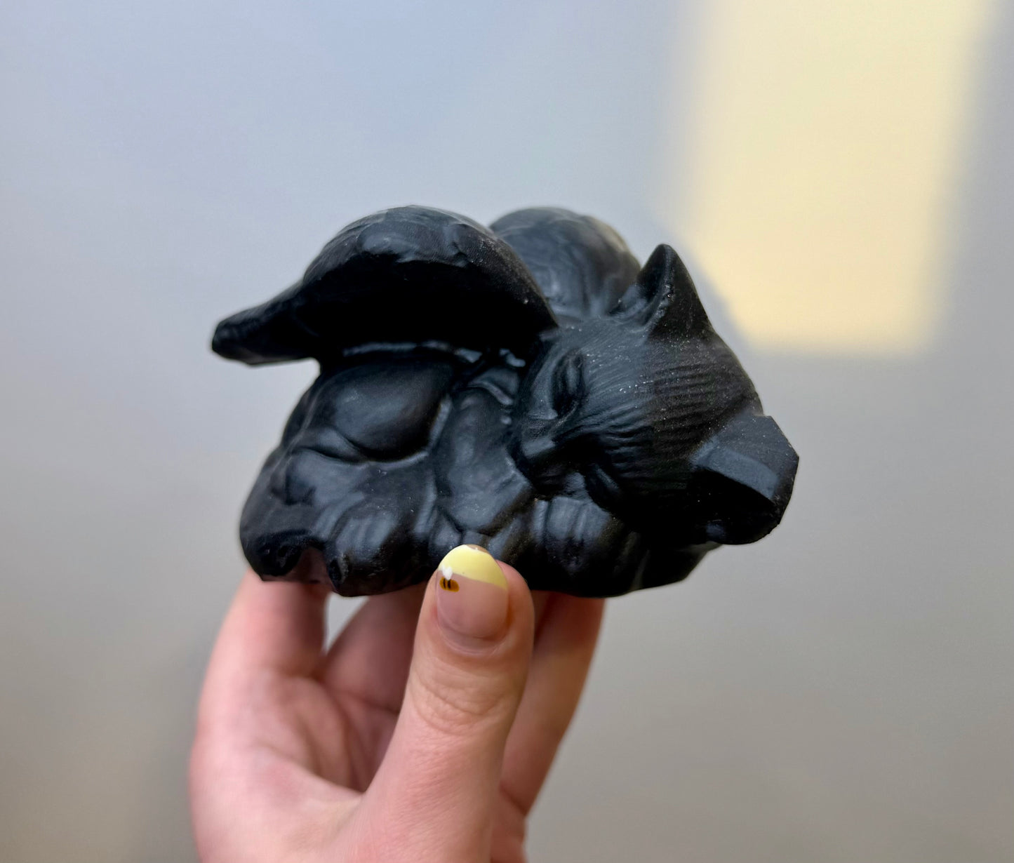Obsidian angel cat carving
