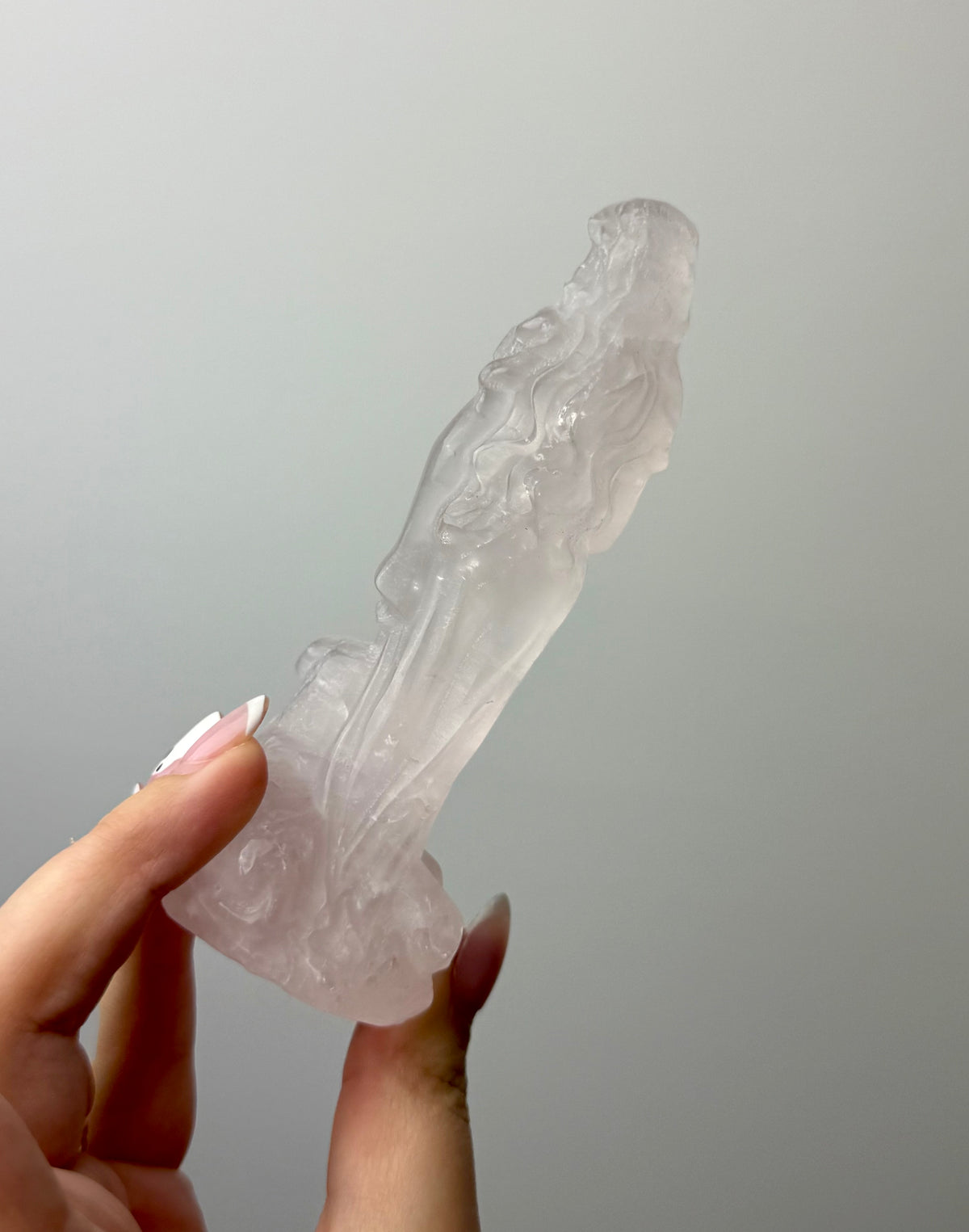Rose quartz goddess with dog carving