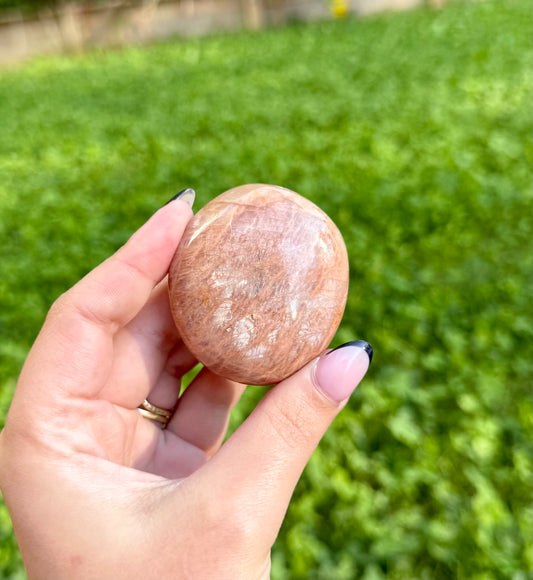 Peach moonstone palm stone