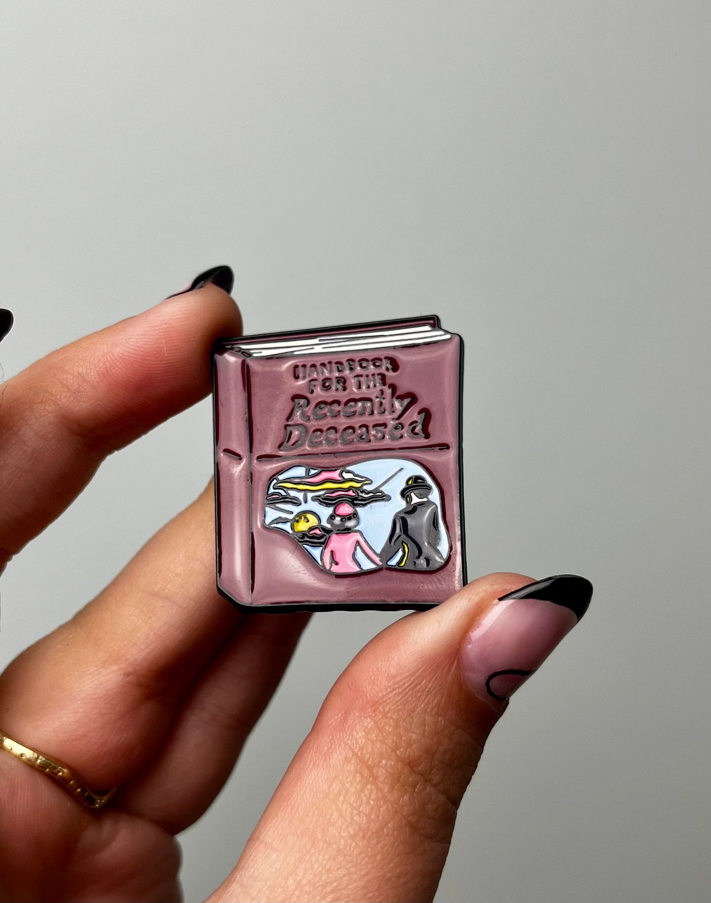 Handbook for the recently deceased Beetlejuice enamel pin