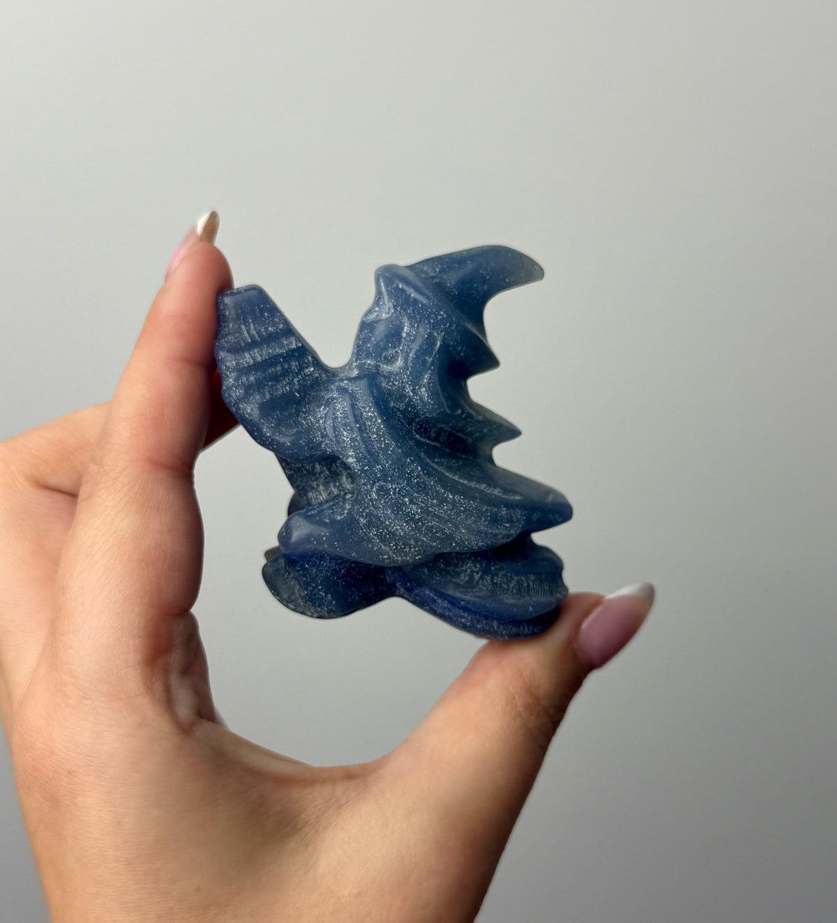 Flying witch carving