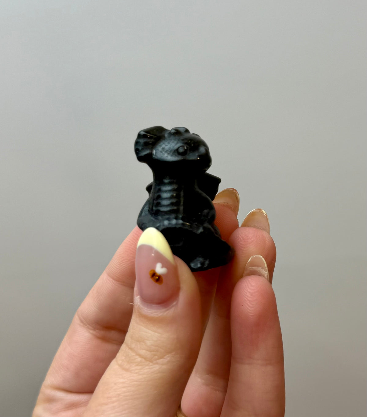 Obsidian dragon carving