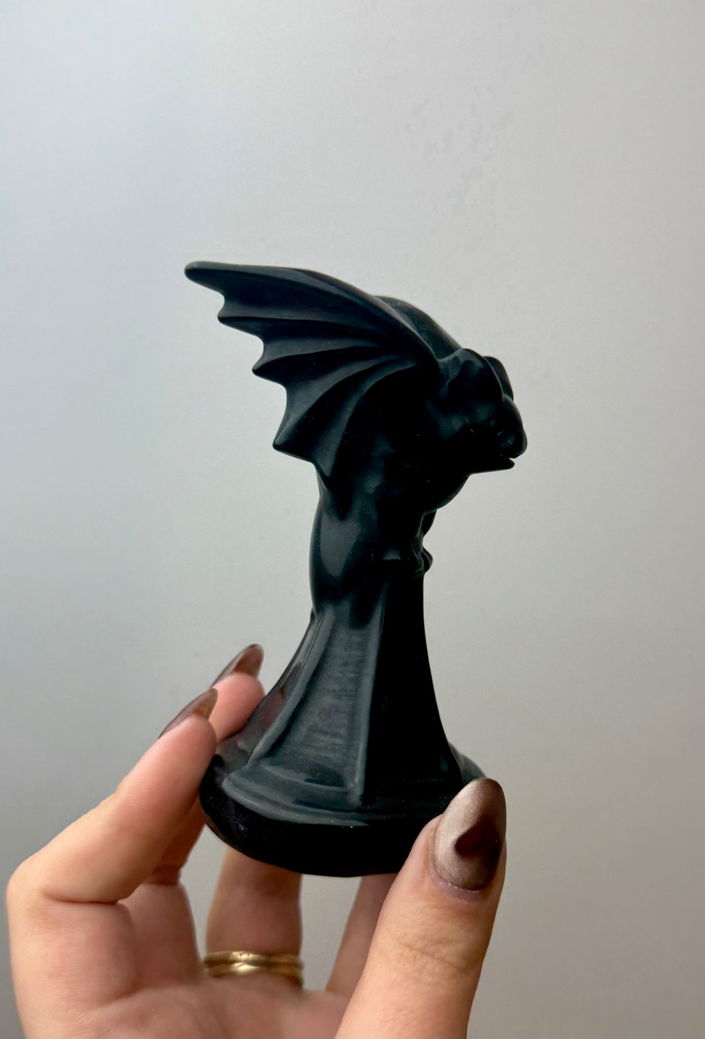Obsidian bat carving