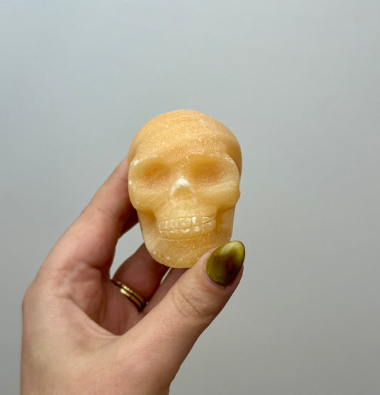 Orange calcite skull carving