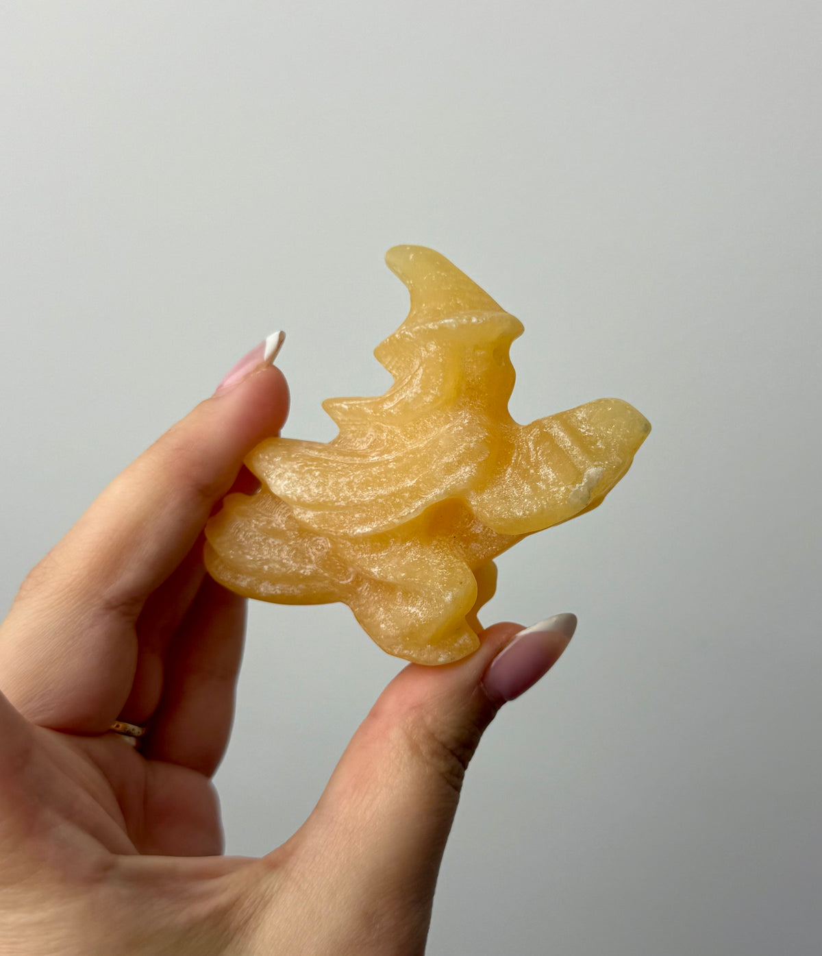 Flying witch carving