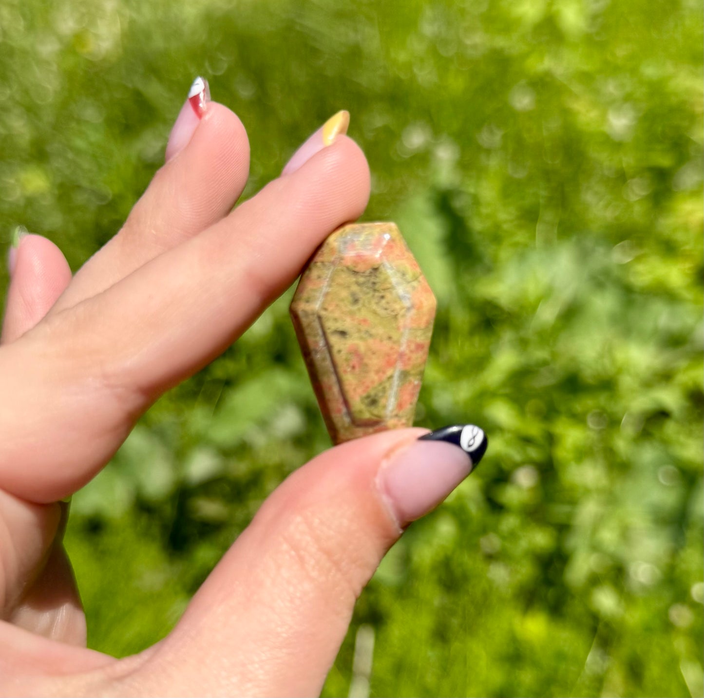 Unakite coffin carving