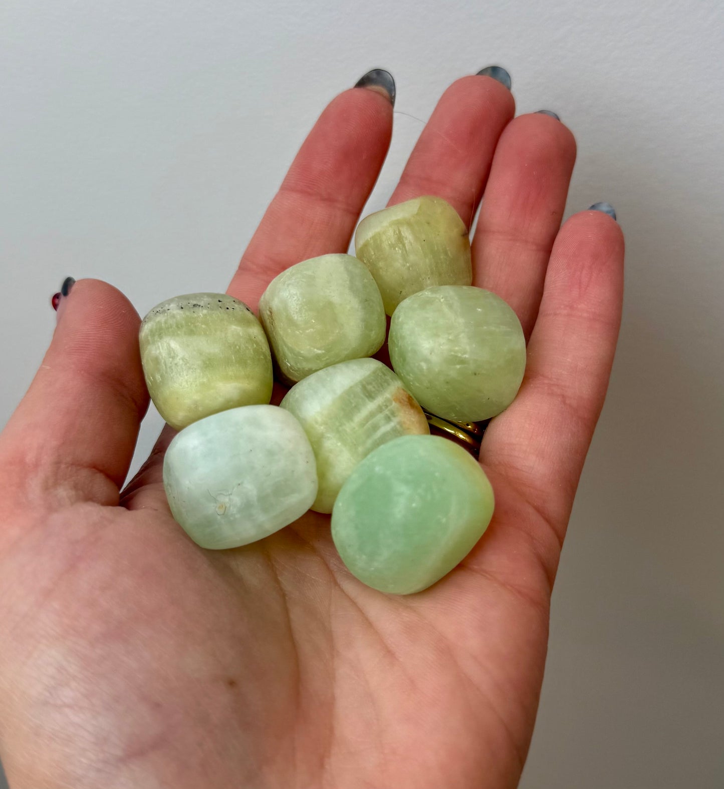 Pistachio green calcite tumbles