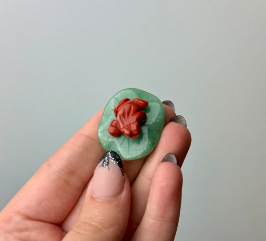 Red jasper frog on lily pad carving