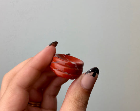 Red jasper sphere stand