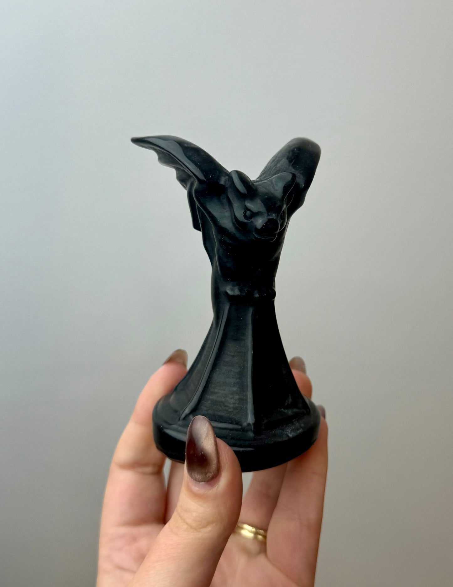 Obsidian bat carving