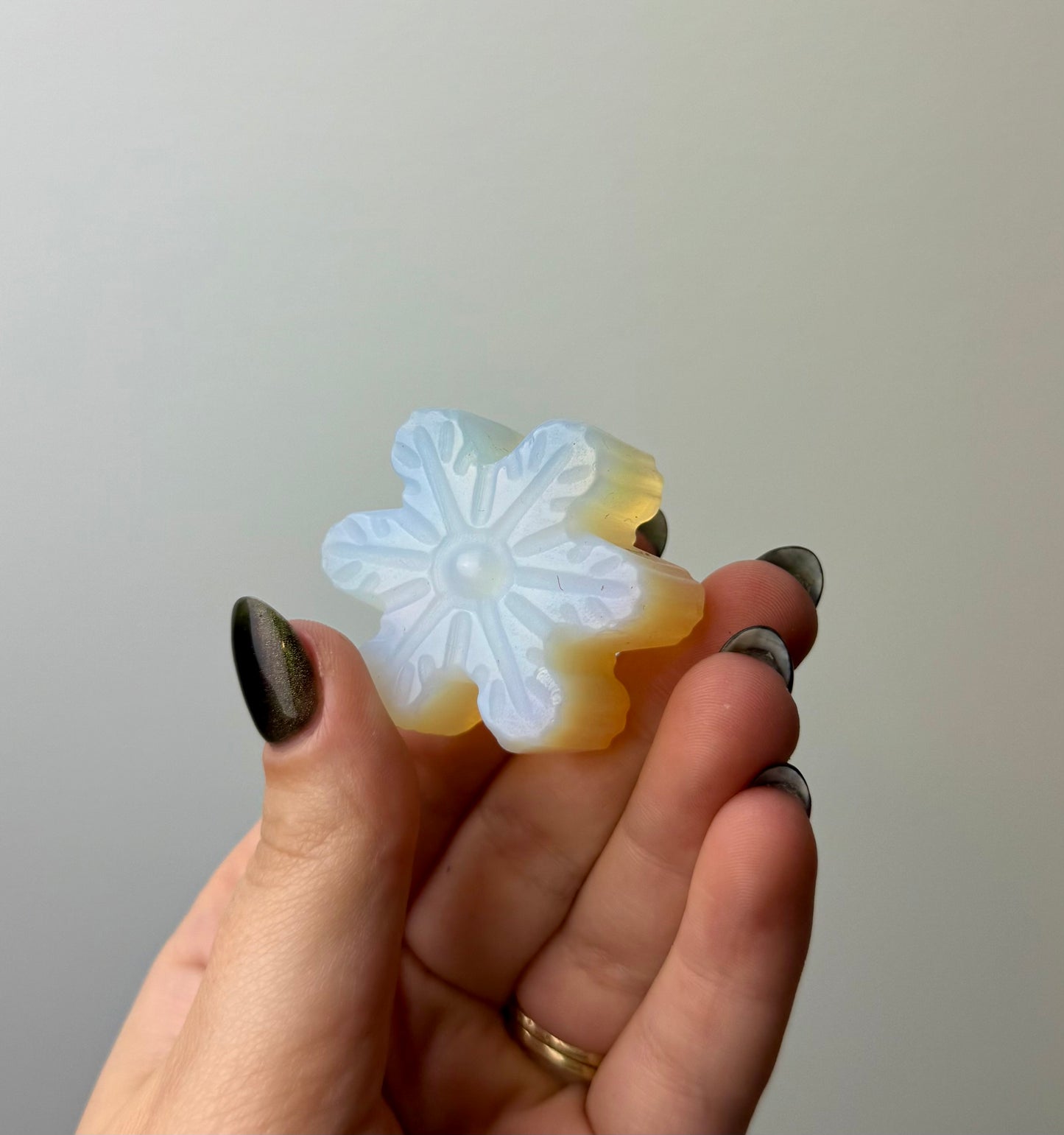 Man made material Opalite snowflake carving