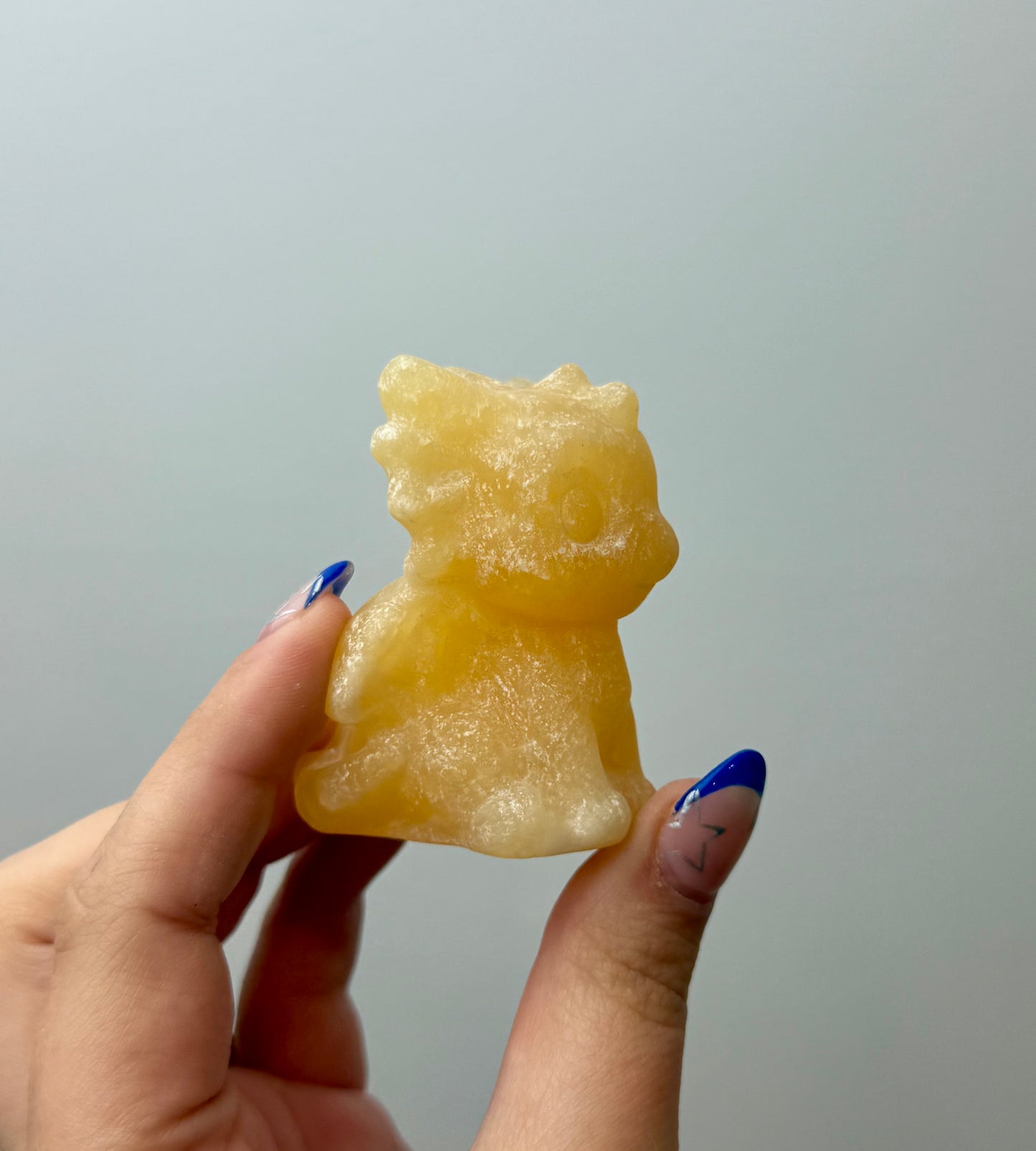 Orange calcite dragon carving