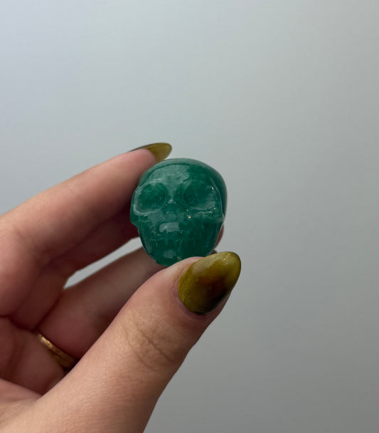 Green aventurine skull carving