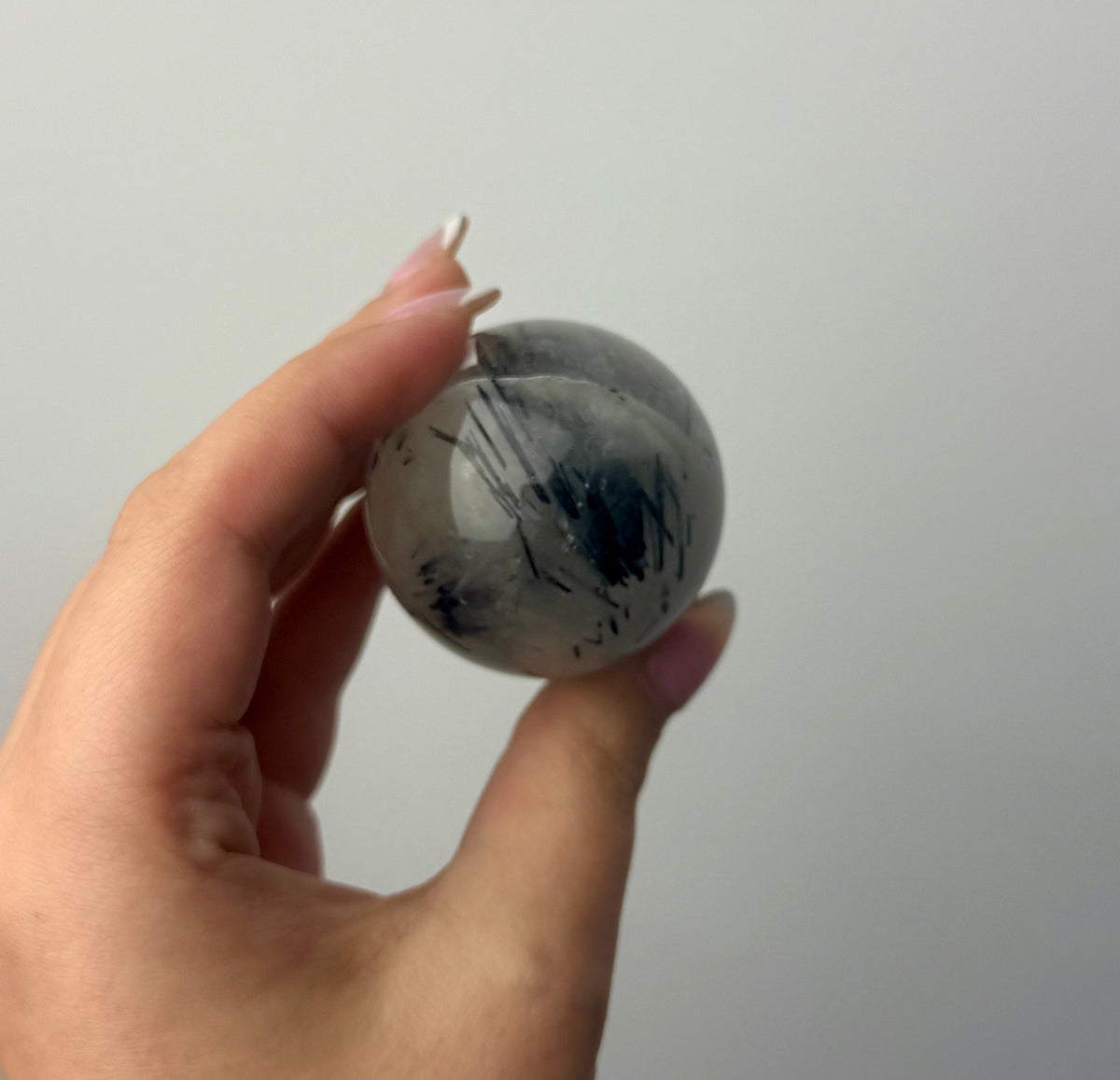 Black tourmaline in quartz sphere