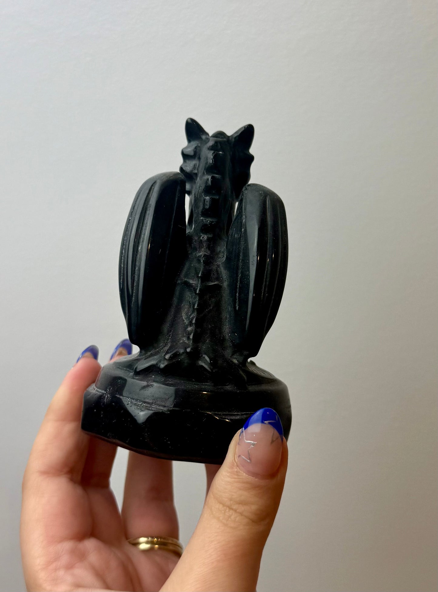 Obsidian dragon carving