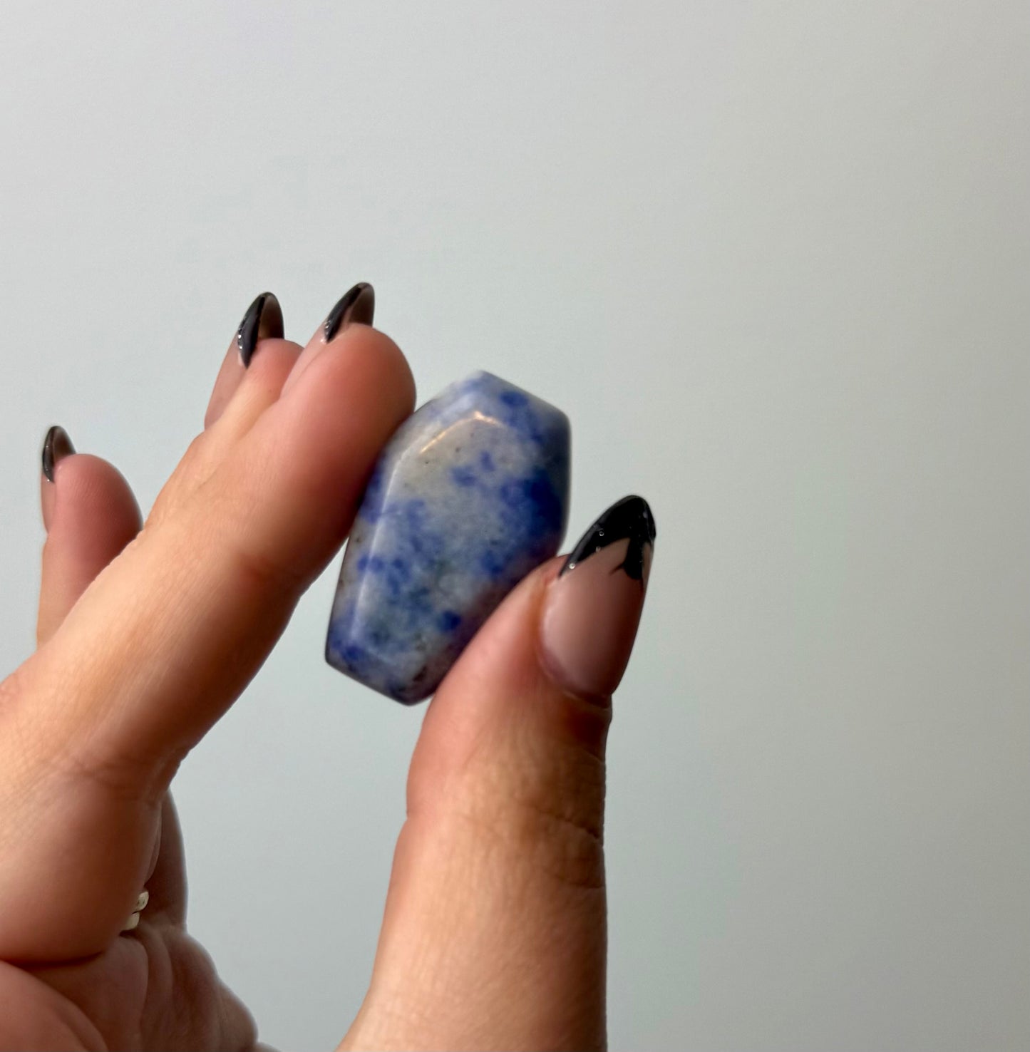Sodalite coffin carving