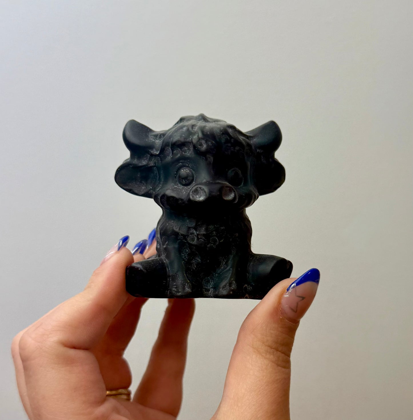 Obsidian cow carving