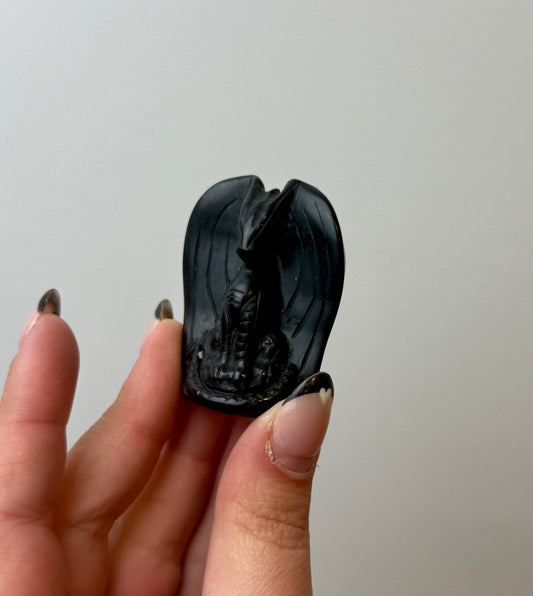 Obsidian dragon carving