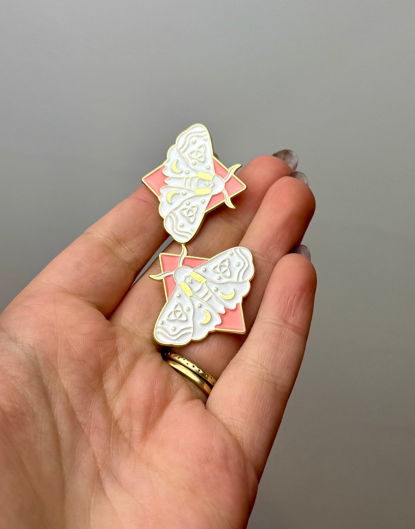 White moth enamel pins